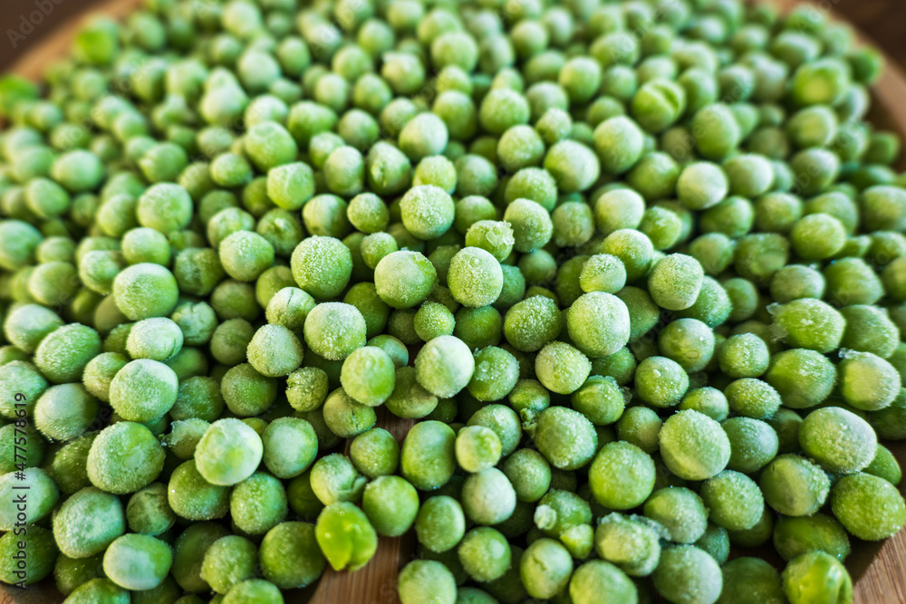 frozen frosty green peas background closeup frozen frosty green peas background closeup