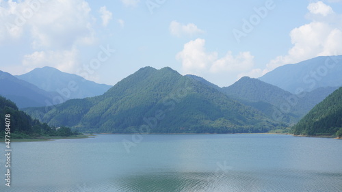 The beautiful lake landscapes surrounded by the green mountains in the countryside of the China