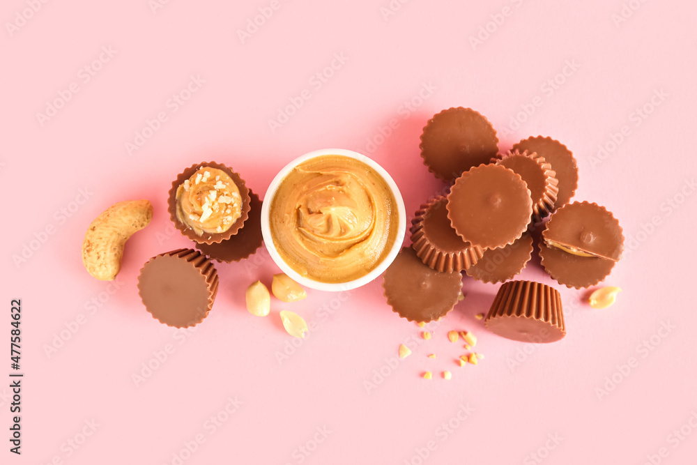 Tasty peanut butter cups on color background Tasty peanut butter cups on color background