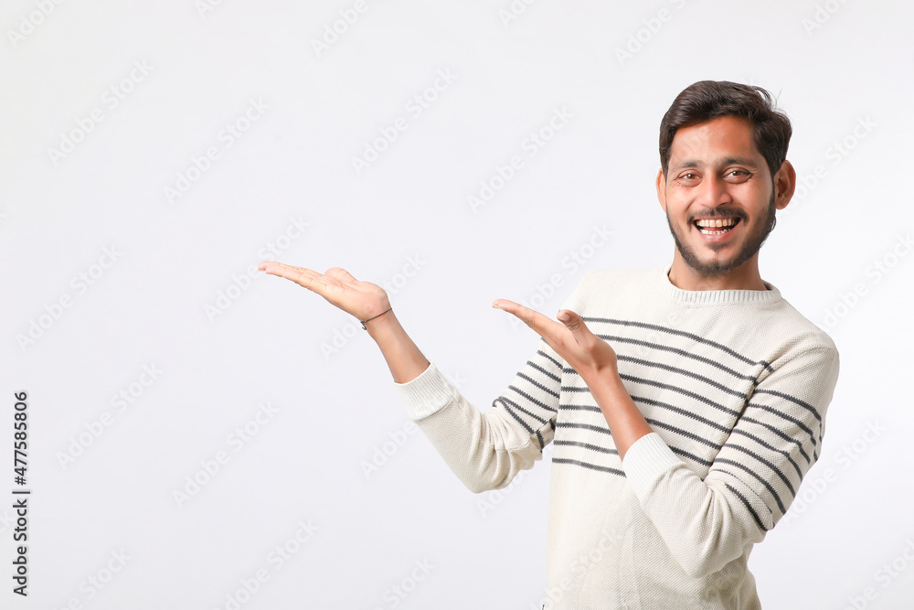 Young indian man giving expression on white background. Young indian man giving expression on white background.