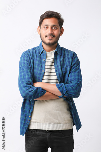 Young indian man giving expression on white background.