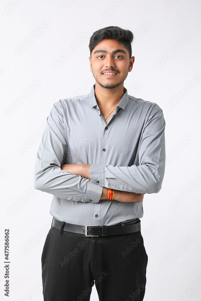 Successful Young indian business man posing over white background. Successful Young indian business man posing over white background.