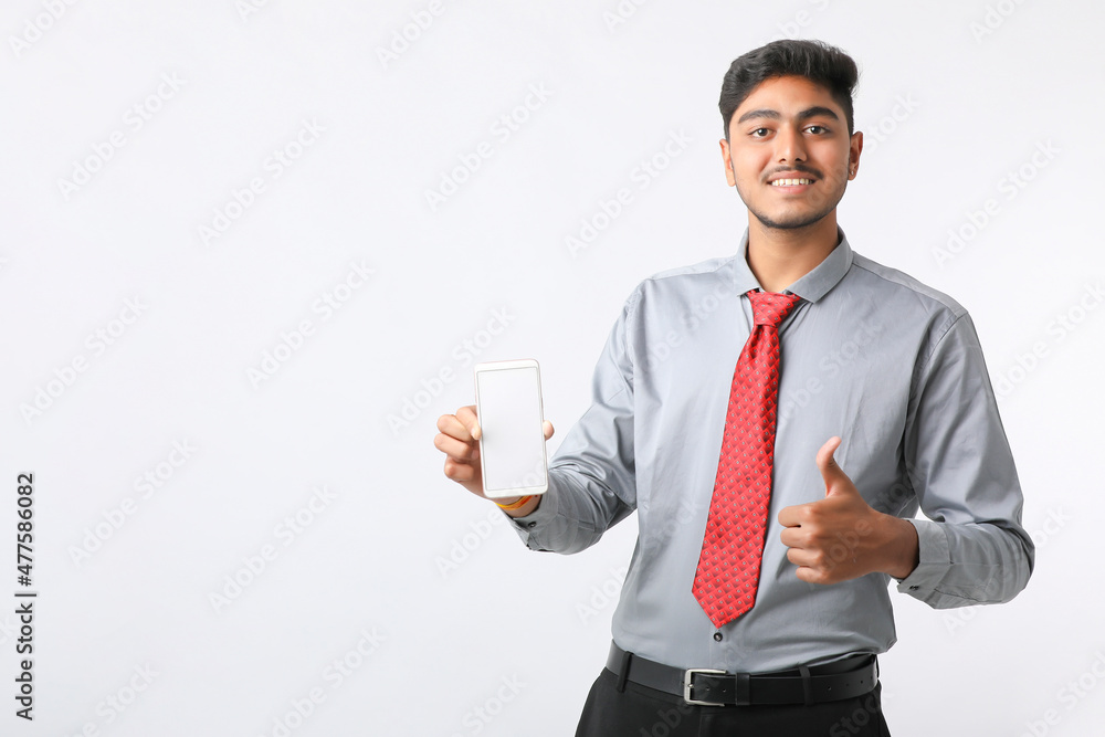 technology concept : Young indian businessman showing smartphone screen. technology concept : Young indian businessman showing smartphone screen.