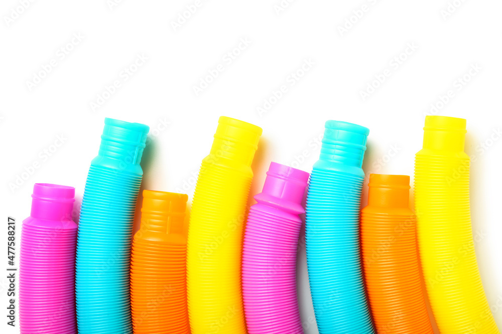 Different colorful Pop Tubes on white background Different colorful Pop Tubes on white background