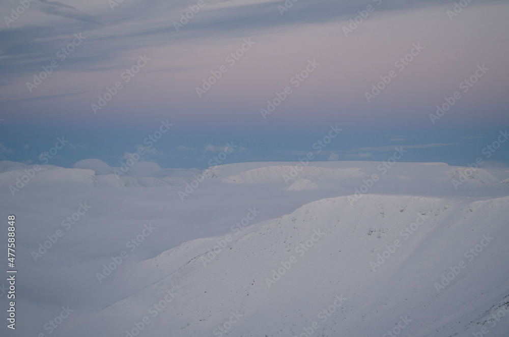 The Khibiny peaks lighted by the  sun  winter background