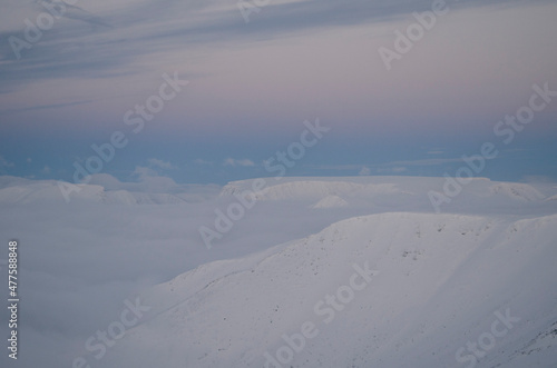 The Khibiny peaks lighted by the  sun  winter background © Svetlana