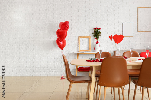 Light room decorated for Valentine's Day with served table