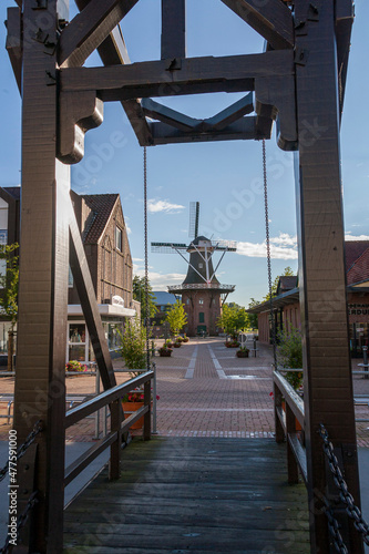 Fussgängerbrücke in Papenburg mit Blick auf Meyers Mühle den Galerie-Holländer photo