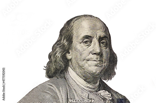 Benjamin Franklin cut from new 100 dollars banknote on white background