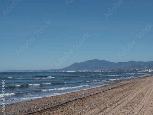 Mediterranean beach with the city of Marbella in the background