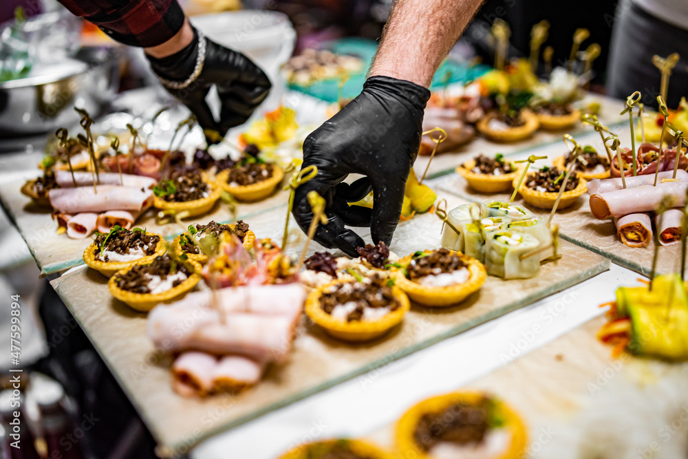 Chef hand is in process of Preparing catering food Chef hand is in process of Preparing catering food