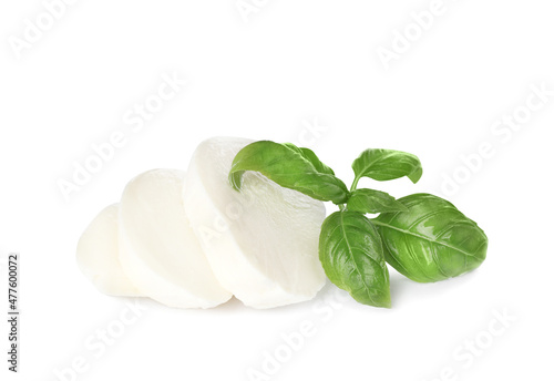 Delicious mozzarella cheese slices and basil on white background