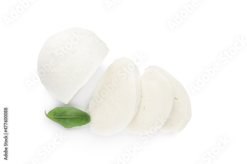 Delicious mozzarella cheese slices and basil on white background, top view