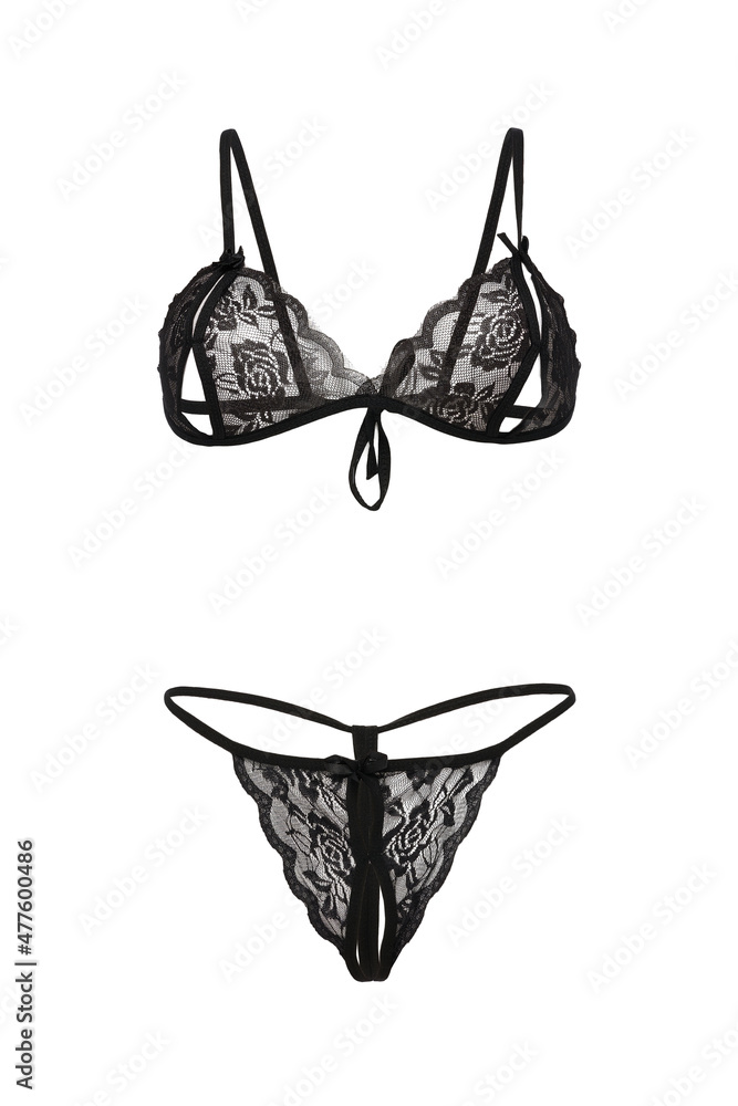 Foto Stock Detailed shot of a black bra with nipple cutouts and a black  G-string with a cutout in the intimate area. The sexy lace lingerie with  ties is isolated on the