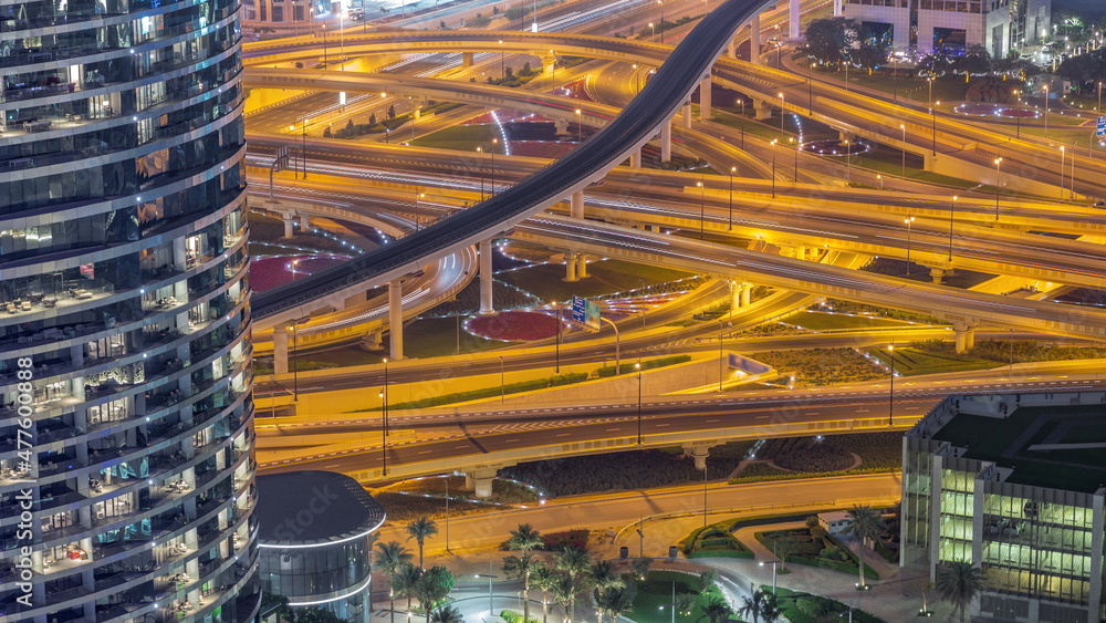 Highway intersection and overpass of Dubai downtown aerial night timelapse.
