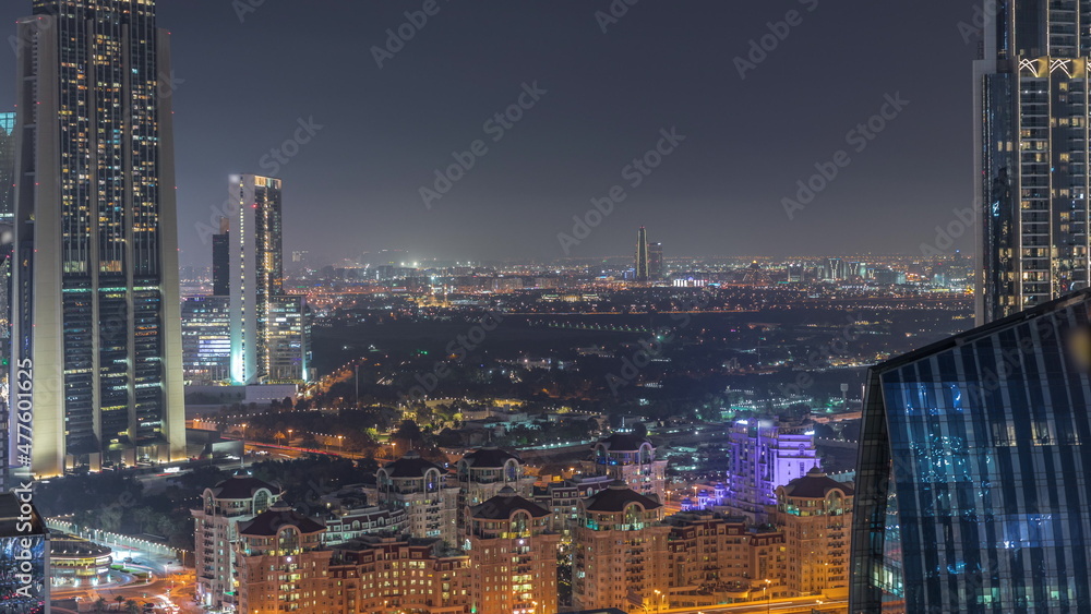 Aerial view of houses in Deira and Dubai creek district with typical old and modern buildings night timelapse.