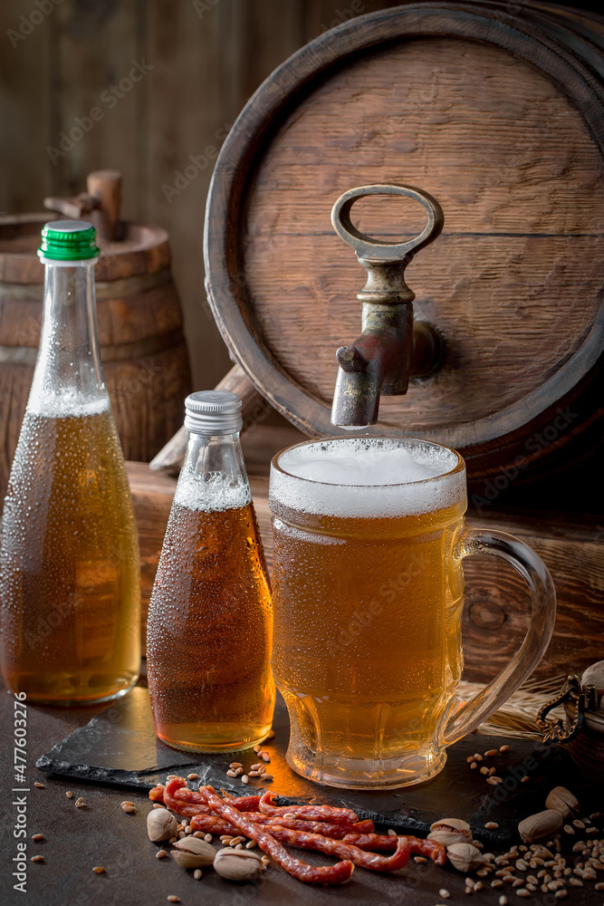 Light beer in a glass on an old background. Light beer in a glass on an old background.