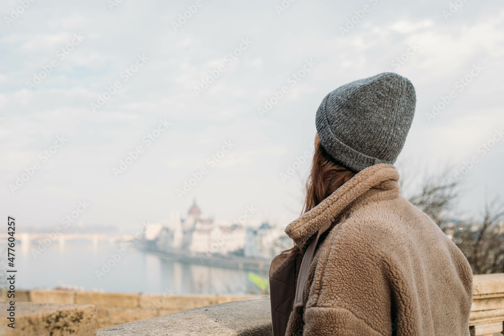 young woman looks at the city view of Budapest