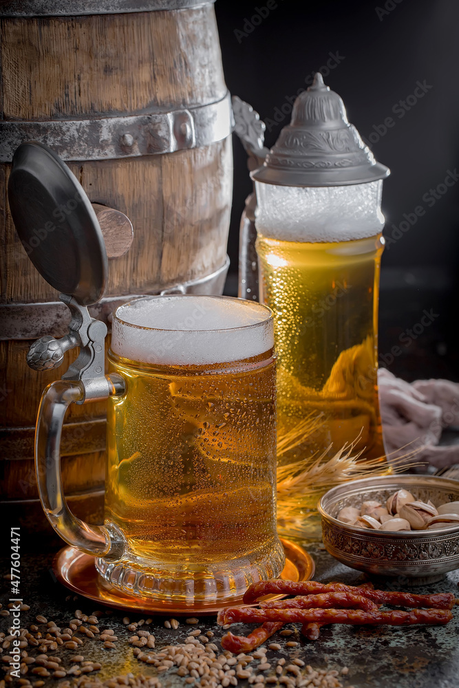Light beer in a glass on an old background. Light beer in a glass on an old background.
