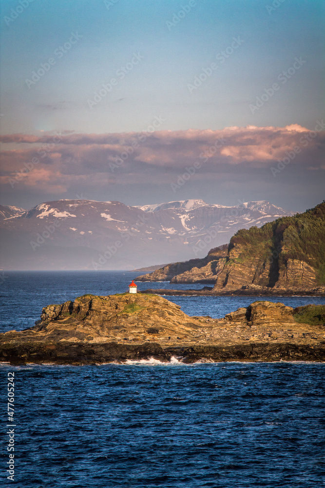 Tiny lighthouse on an islet in Norway