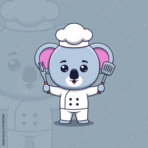 Cute koala chef holding spatula and barbecue fork