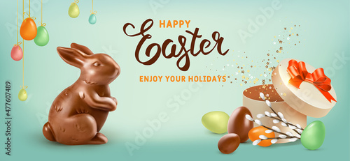 Happy Easter holiday. Chocolate Easter Rabbit with gift and willow branches on green background. Realistic vector illustration. Easter banner.