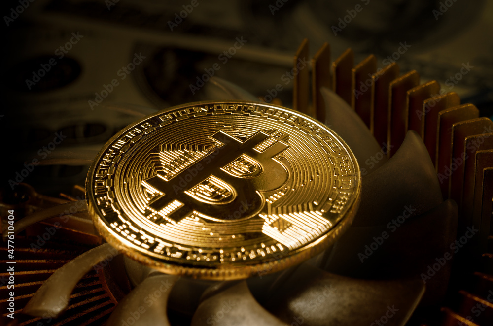 Obraz na plátně Physical Gold Bitcoin Coin on a computer video card