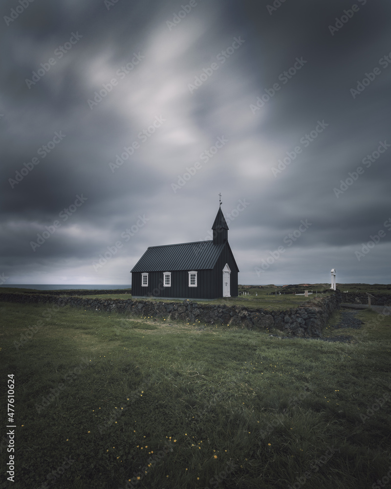 Moody view of famous Black Church (Búðakirkja), Búðir on Snæfellsnes peninsula, Western Iceland against dramatic sky