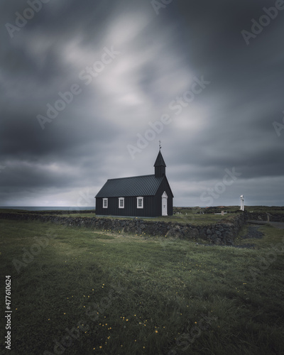 Moody view of famous Black Church (Búðakirkja), Búðir on Snæfellsnes peninsula, Western Iceland against dramatic sky