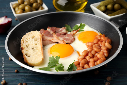 Concept of tasty breakfast on wooden background