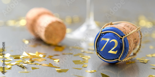 Champagne cap with the Number 72 photo