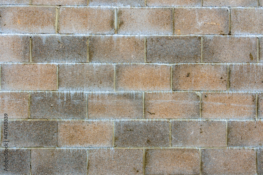 Fototapeta premium Section of a red and grey breeze block wall