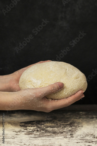 dough on a board in hands