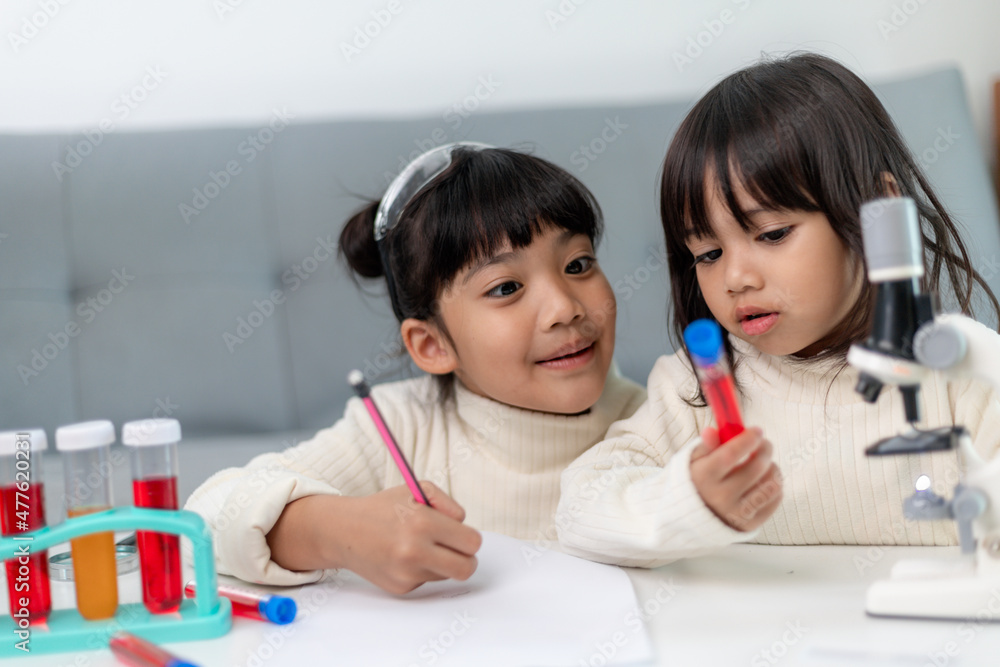 young girl play science experiments for homeschooling