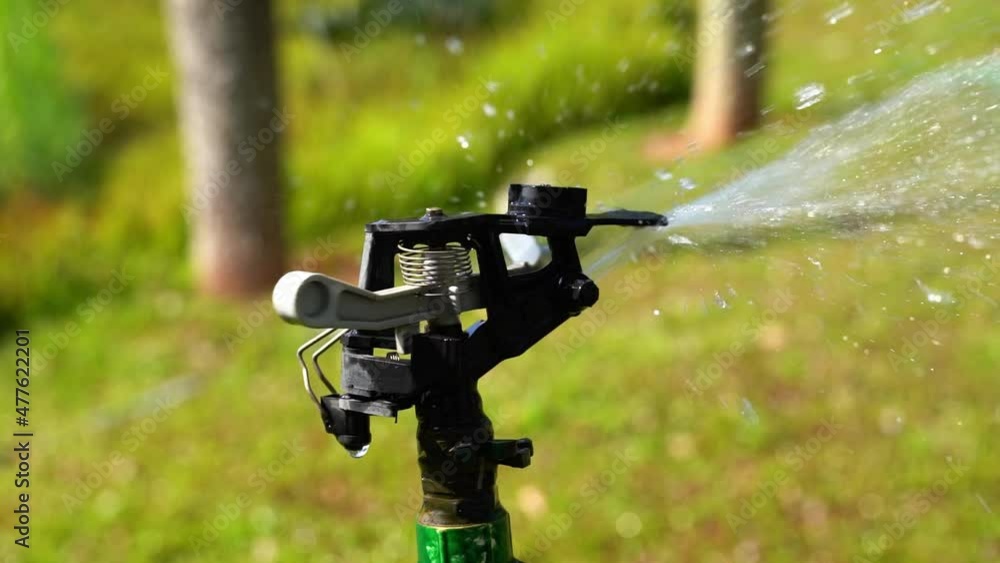 Automatic watering device for watering plants in the park, upgrading in slow motion Automatic watering device for watering plants in the park, upgrading in slow motion