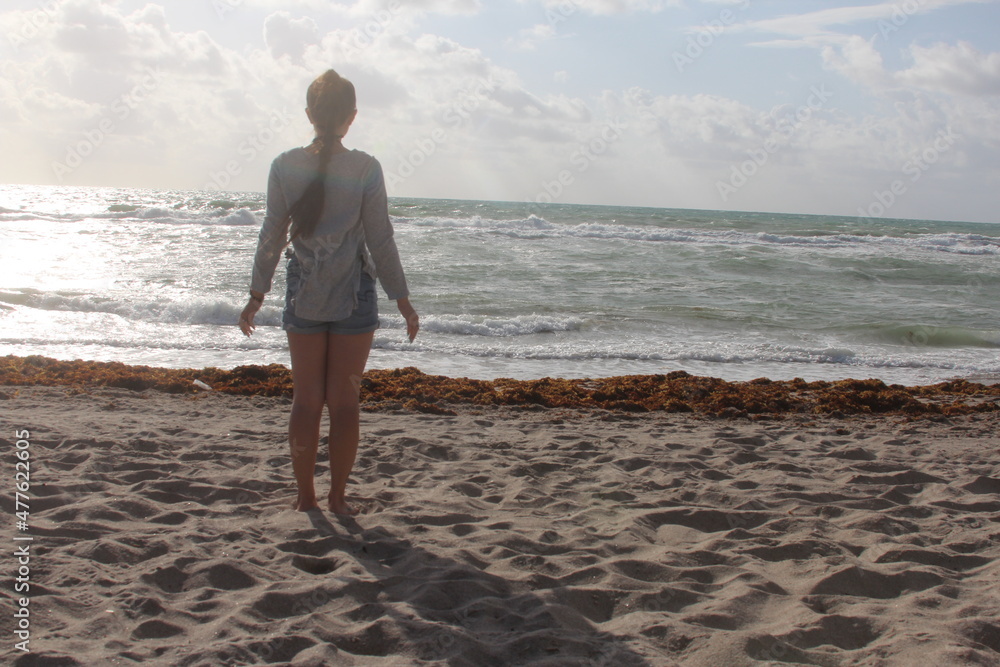 girl on the beach in the morning girl on the beach in the morning