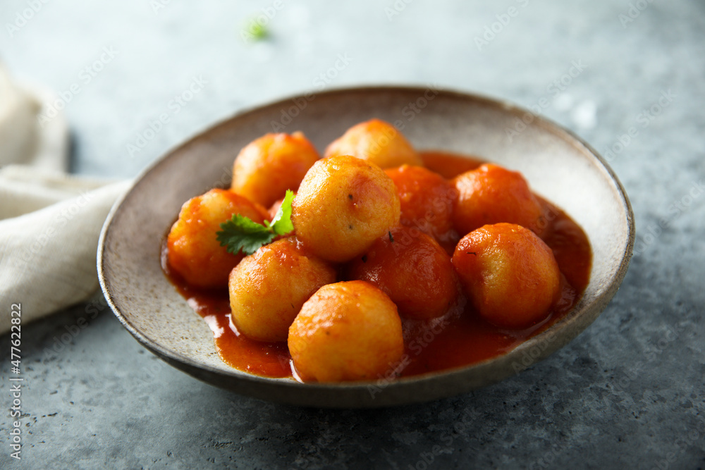 Traditional homemade dumplings with tomato sauce Traditional homemade dumplings with tomato sauce