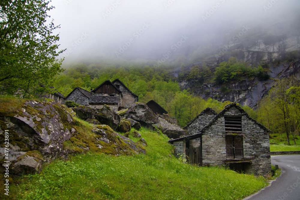 Stone houses an Waterfall Val Bavona, Cevio in Switzerland spring 2021 Stone houses an Waterfall Val Bavona, Cevio in Switzerland spring 2021