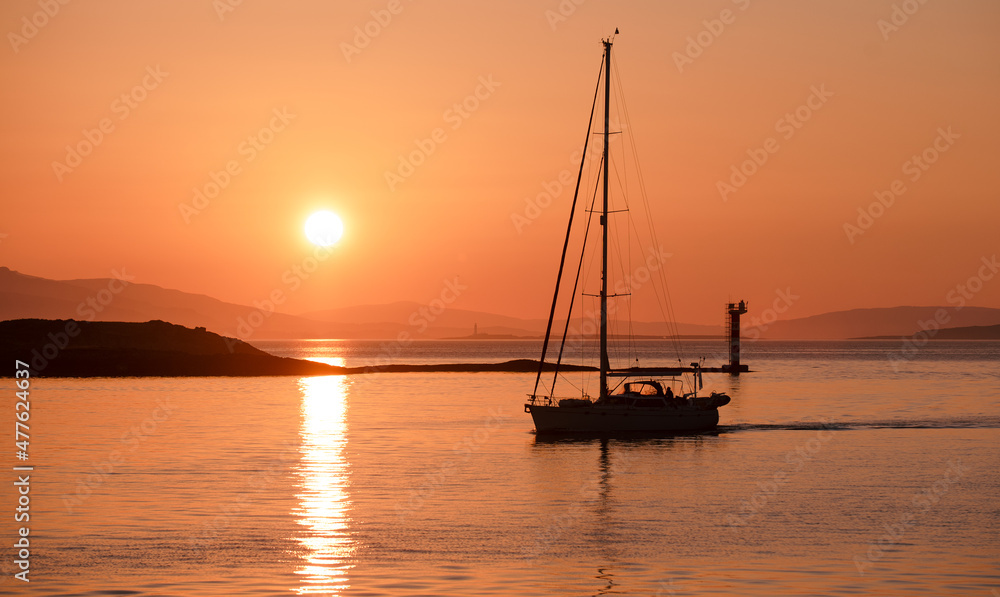 Sailing Boat (Yacht) Returning to Harbour at Sunset - Silhouette - Oban, Scotland
