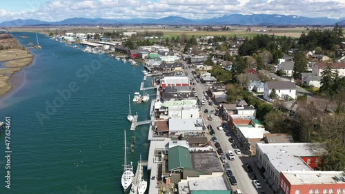 Cinematic 4K aerial drone dolly clip of Swinomish Village, Swinomish Channel and La Conner on a native American indian tribal reservation in Washington photo