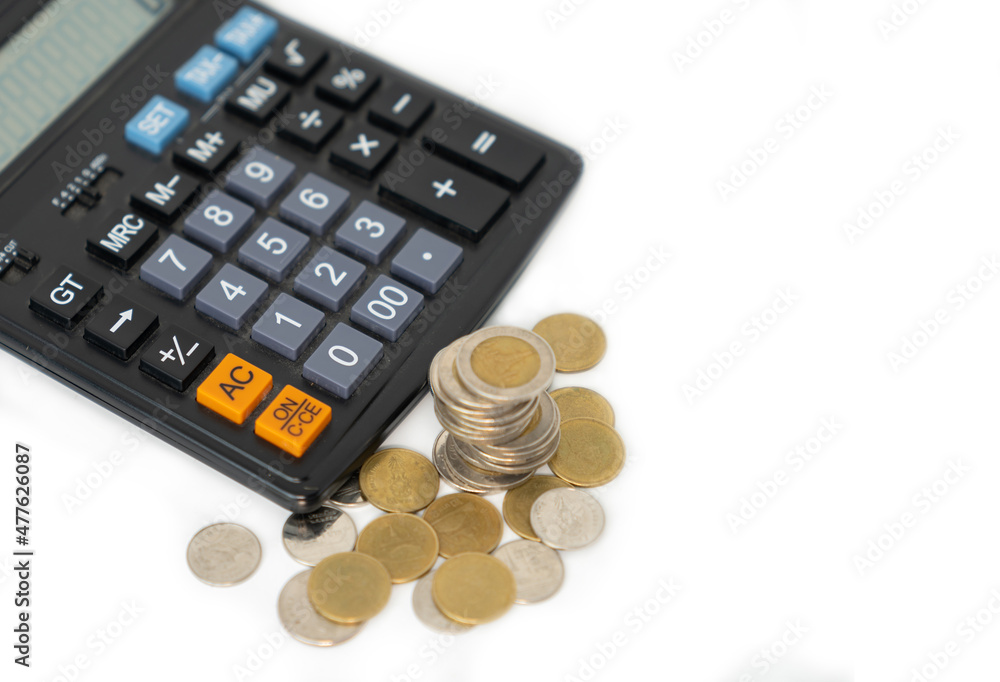 Saving and investment concept with caculator and money coin. Saving and investment concept with caculator and money coin.