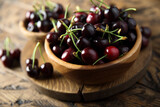 Fresh ripe cherry in a wooden bowl
