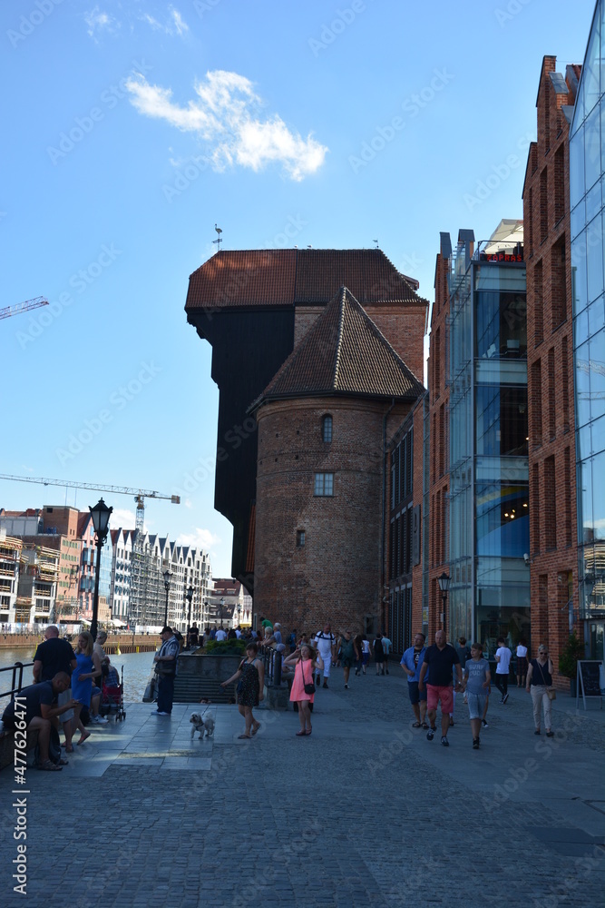The famous Krantor, city gate with tourists in Danzig, Gdansk, Poland in summer with blue sky