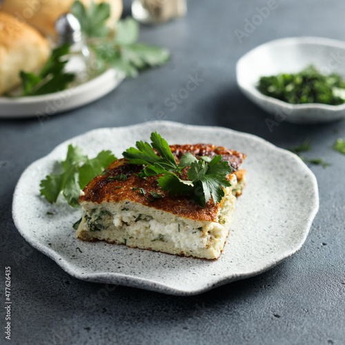 Traditional homemade frittata with herbs and cheese