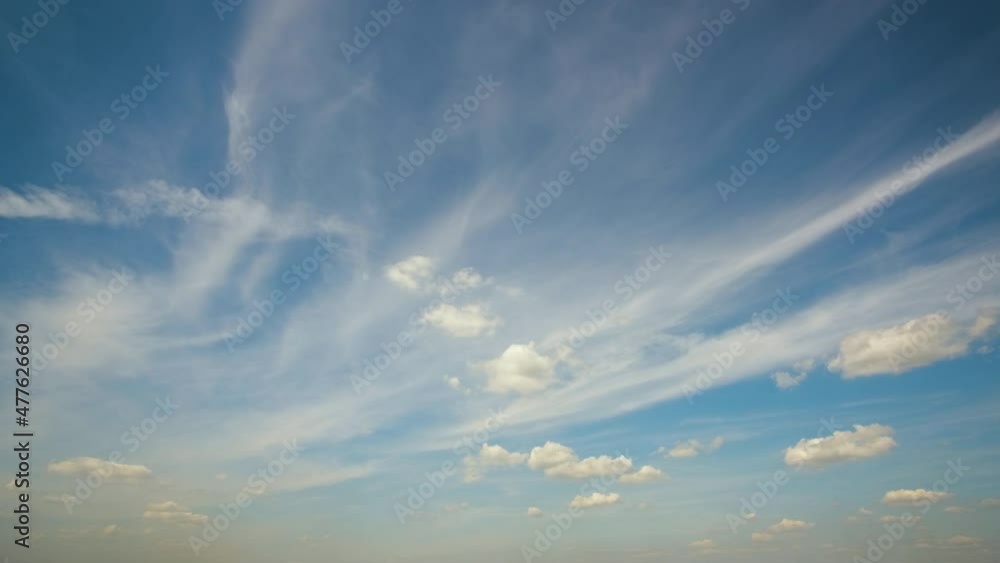 Timelapse of white puffy cumulus clouds forming on summer blue sky. Moving and changing cloudscape weather Timelapse of white puffy cumulus clouds forming on summer blue sky. Moving and changing cloudscape weather