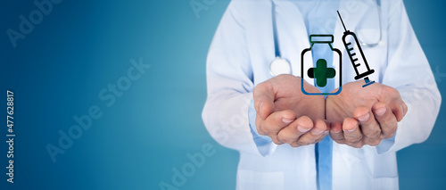 Fototapeta Naklejka Na Ścianę i Meble -  Doctor holding a vaccine and syringe icon in his hand