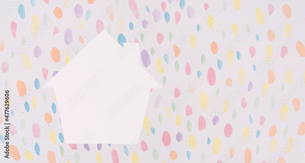 White houses shaped and multicolored dots.homeless housing and home protection insurance concept, international day of families, foster home care,kids,and family. White houses shaped and multicolored dots.homeless housing and home protection insurance concept, international day of families, foster home care,kids,and family.