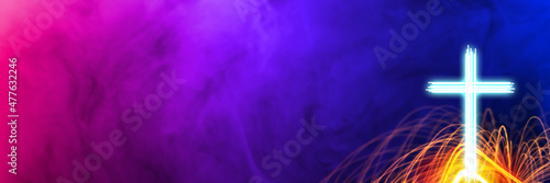 Glowing cross with light streaks in colorful abstract background. Religious theme background with copy space.