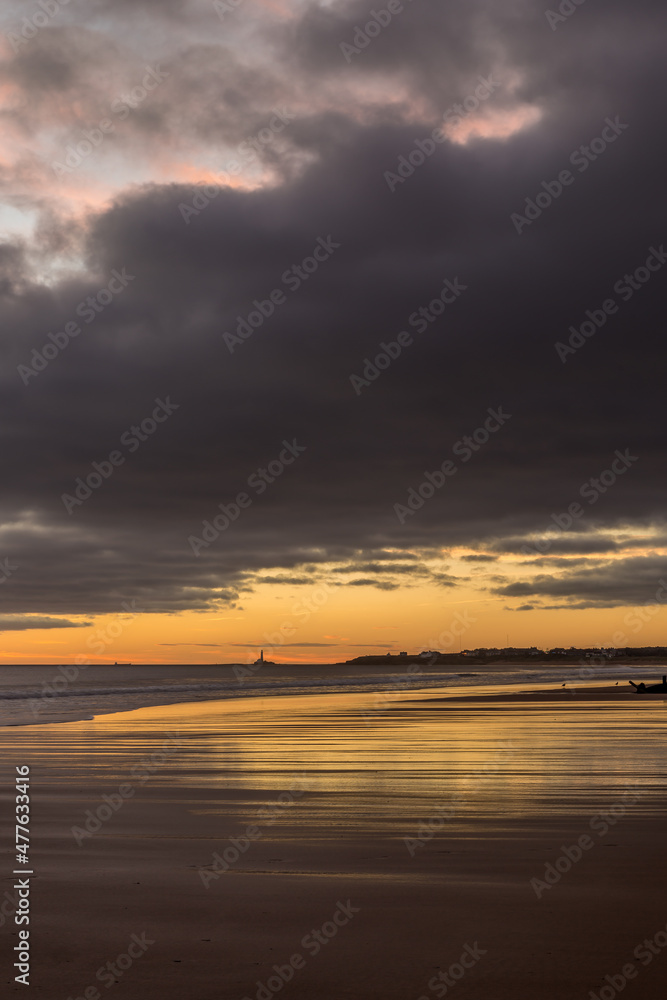 Sunrise to start the day at Blyth beach in Northumberland, with St Mary's Lighthouse in the distance Sunrise to start the day at Blyth beach in Northumberland, with St Mary's Lighthouse in the distance