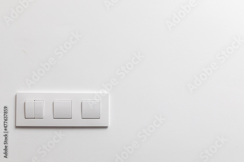 White Light Switches on White Wall